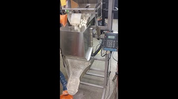 The Logical Machines Model S-4 Automatic Scale System filling 6.16lbs Salt Tablets.