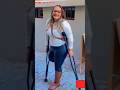 Amputee lady walking with crutches with esse #limbloss #crutches
