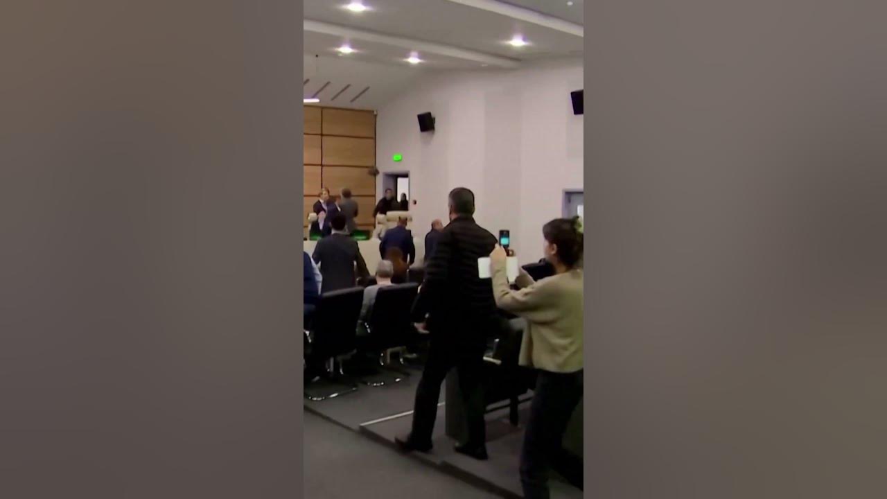 Moment Georgia’s election chief is doused in PAINT