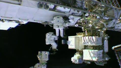 US spacewalkers float out to lubricate robotic arm