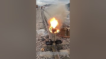 "Railway Repair Magic: Workers Pour Molten Steel to Fix Tracks | Metal Welding Innovation"