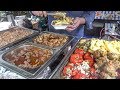 Street food from Greece, Yummy and Colourful Fried Courgette Puffs, Tomatoes, Chicken and Meats