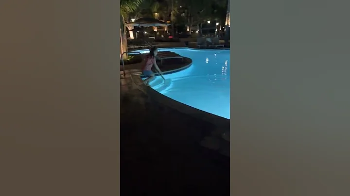 Eric and Skylee jumping into the Marbrisa pool wit...