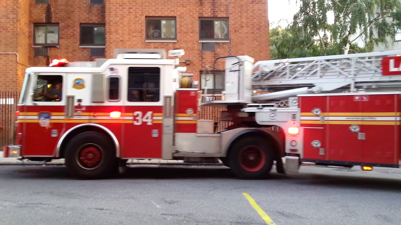 FDNY tiller ladder 34 responding from quarters to a lock in - YouTube