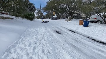 Sleding it snowed in Austin!!!!’