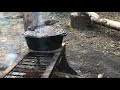 Campfire cooking a dutch oven roast chicken