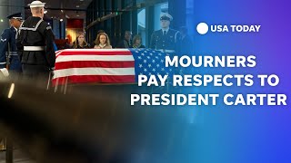 Mourners pay respects to President Jimmy Carter