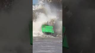 Traditional Fishing Boat Fighting against Large Waves