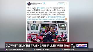Clowney delivers trash cans filled with toys