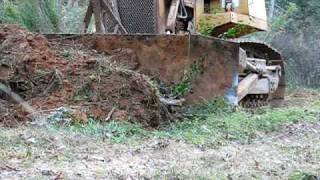 Case 1550 Dozer - Clearing off Debri for a road.