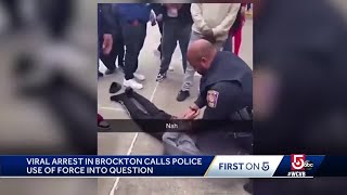 School officer on leave after video shows him kneeling on student