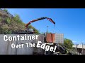 Moving a Shipping Container on the Edge of a Hill