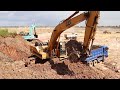 Mini Excavator Cat EL 300 Working &amp; Loading soils on The Trucks