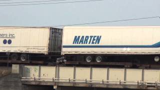 CSX Q017 Train Powers By on Raised Tracks