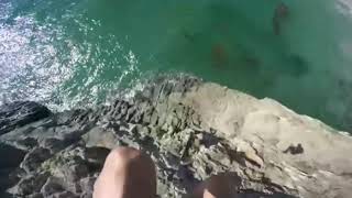 Guy jumps off cliff into water transition meme