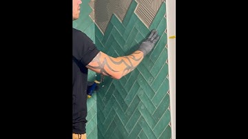 How to install tile in a herringbone layout #bathroomtiles #diy #tiletransformation #bathroom