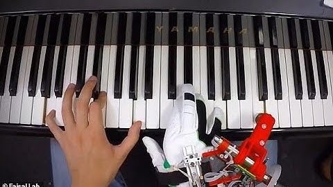 Pianists fitted with a robotic THUMB can adjust to playing the keyboard
