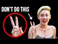 Why Rocking a Peace Sign in Your Photos Can Put You in Danger