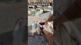 Enjoying grilled fish by the stream is amazing 🐟🔥#food #cooking #nature #camping #short