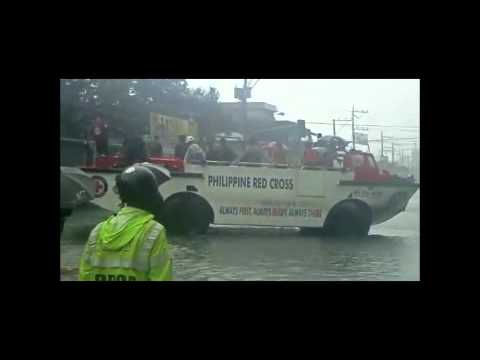 Red Cross staff on board amphibious vehicle rescue flooded residents