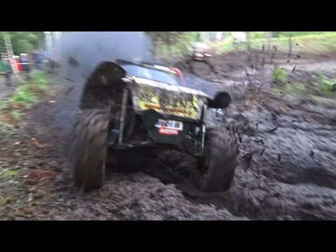 Off-Road vehicle mud race in forest
