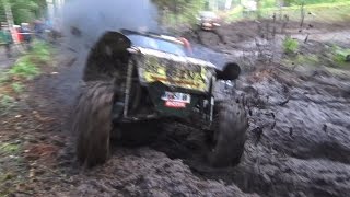 Off-Road vehicle mud race in forest