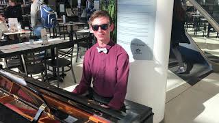 Blue Rondo a la Turk by Dave Brubeck, played by pianist, Evan Brezicki, at the Charlotte airport.