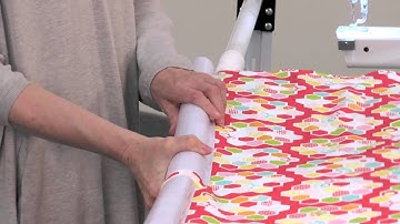 loading the quilt fabric on an SR-2 Quilting frame