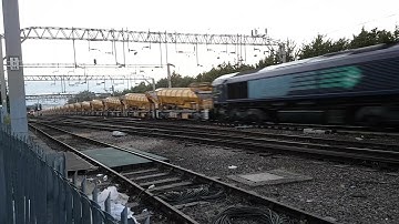 The very lengthy Network Rail HOBC (High Output Ballast Cleaner) powers through Colchester at speed