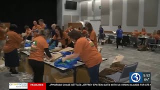 Volunteers help prepare the Eversource Hartford Marathon