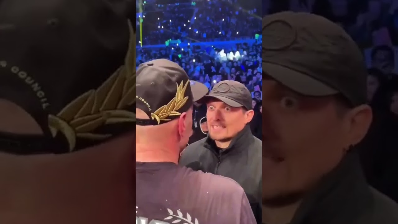Usyk silently staring back at Tyson Fury during their post-fight confrontation…