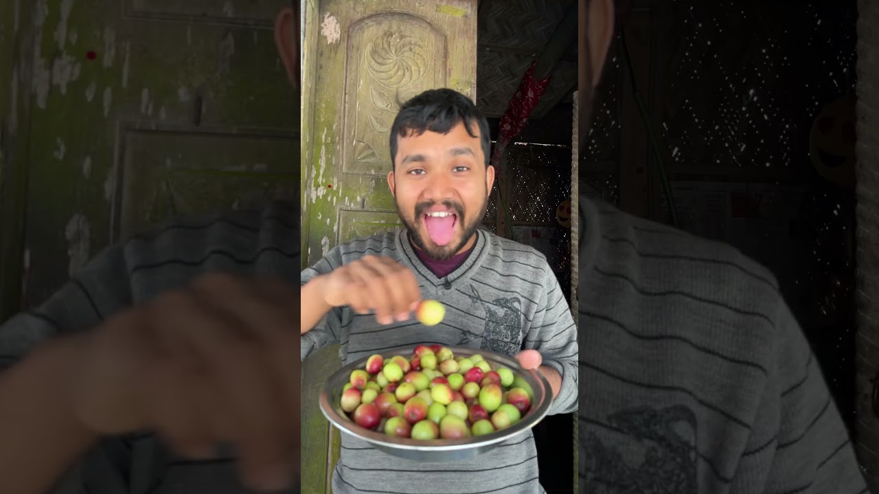 Eating tiny mango with dry spicy salt