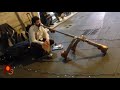 Street musician  guy playing pipes in the streets of the world