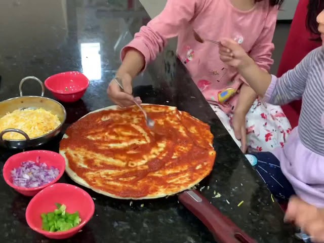 Kids making Molinaro’s pizza at home