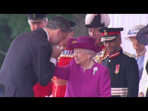 The King Of Spain Greets The Queen With A Kiss