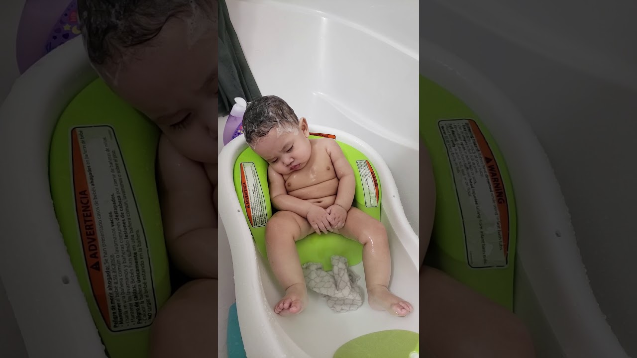 Cute baby falling asleep in the bath!!