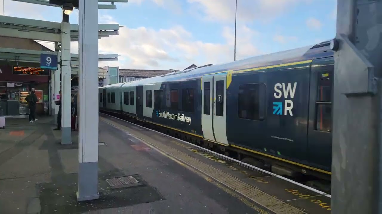 450075 and 450008 passing Clapham Junction