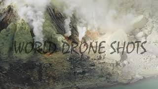 Drone shot moving in on miners working at crater bottom, Ijen volcano (Kawah Ijen), East Java 4k