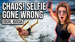 Beach selfie turns chaotic as wave crashes ashore in Sochi, Russia