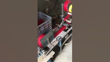 Machine to braid firecrackers into strings of various lengths
