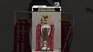 PM Modi, UK PM Keir Starmer pose with English Premier League Trophy in London