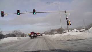 Snow plows clear covered streets in Hoffman Estates