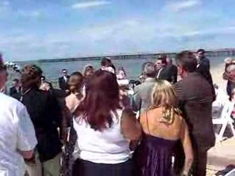 Wedding On The Beach Groom Kisses Bride