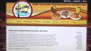 Tourists react to a Huck Finn's Cafe waiter printing a racial slur on a customer's receipt