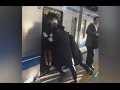 Professional Pushers Shove Passengers Onto Busy Tokyo Train