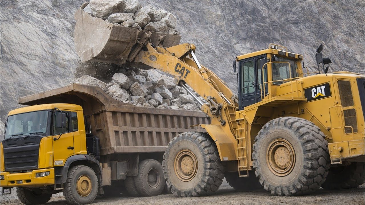 Excellent work With Big Caterpillar Loadar loading Stone into Biggest Dumpar in Mountain