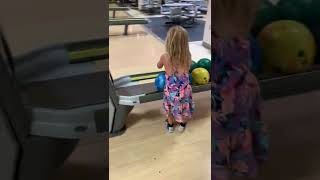 Little girl slips in bowling alley then ball rolls off her forehead