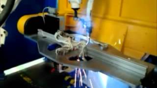 Robotic welding of a car armrest.avi