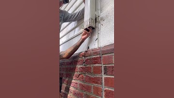 Unclogging gutter downspout #pressurewashing #gutters