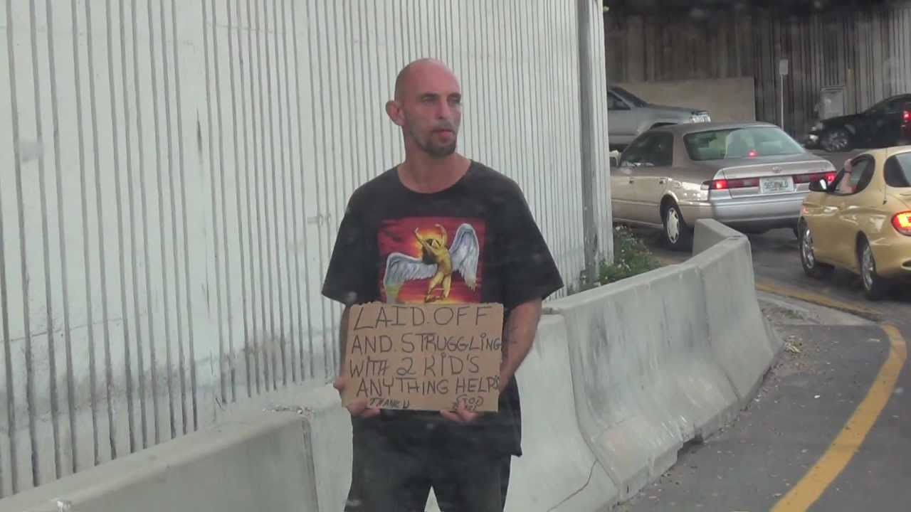 HOMELESS MAN HOLDING SIGN IN CLEARWATER I GAVE HIM A 1.00 BILLTHEY MAKE